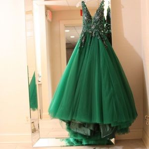 Plunging V neckline and back with a semi-sheer bodice layered with a Tulle skirt